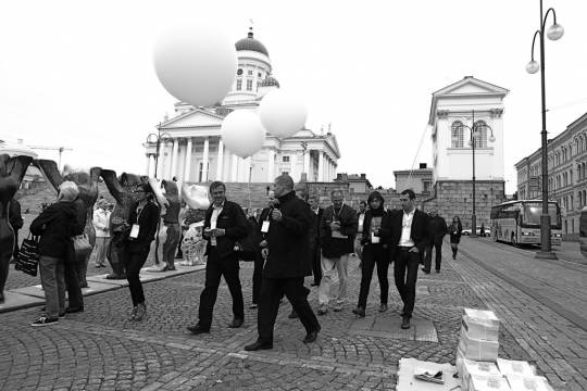 HDL guides with white balloon helping guests move between venues